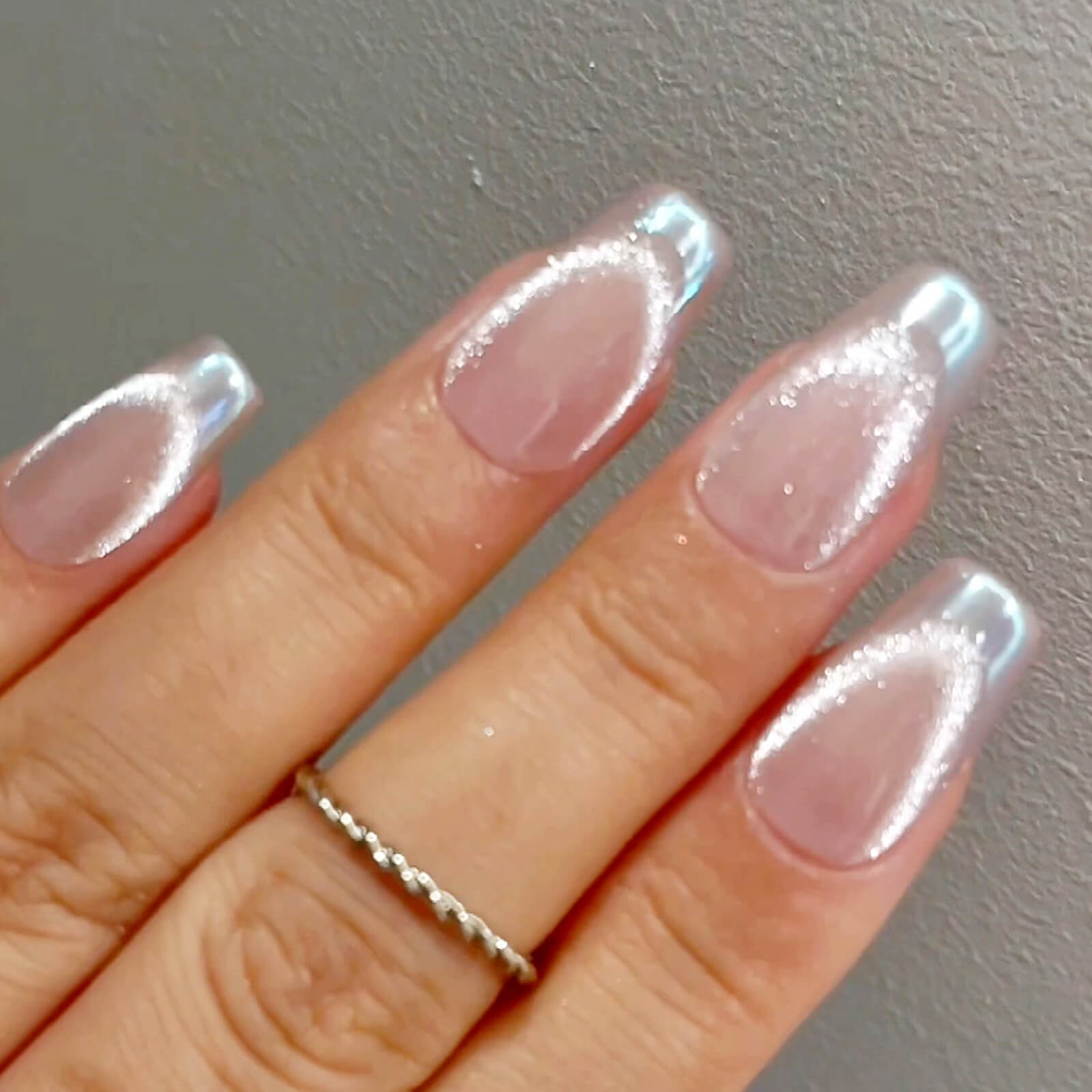Fashionable French Tips with Chrome Cat Eye Design